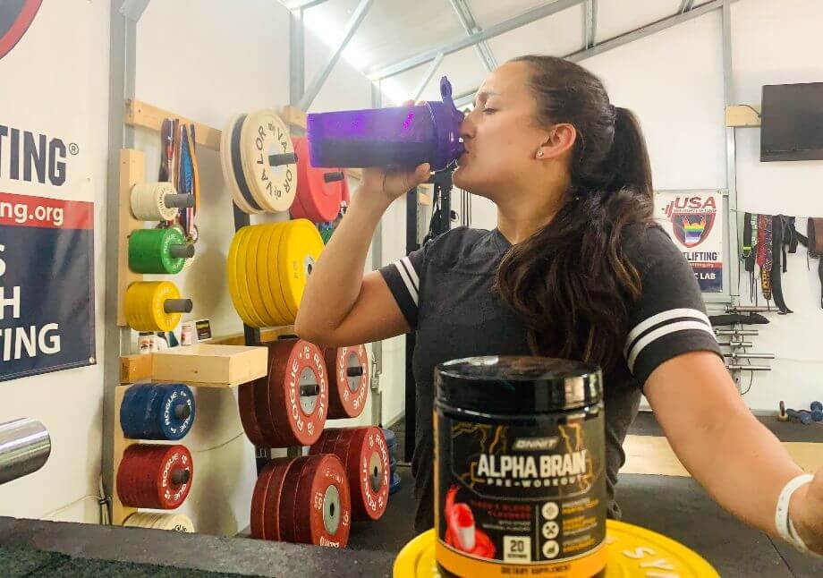 Woman Drinking Alpha Brain Pre Workout